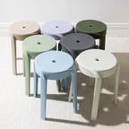 A collection of stackable stools in soft neutral and contemporary colours showcases their clean, minimalist design and versatile style for both indoor and outdoor living.