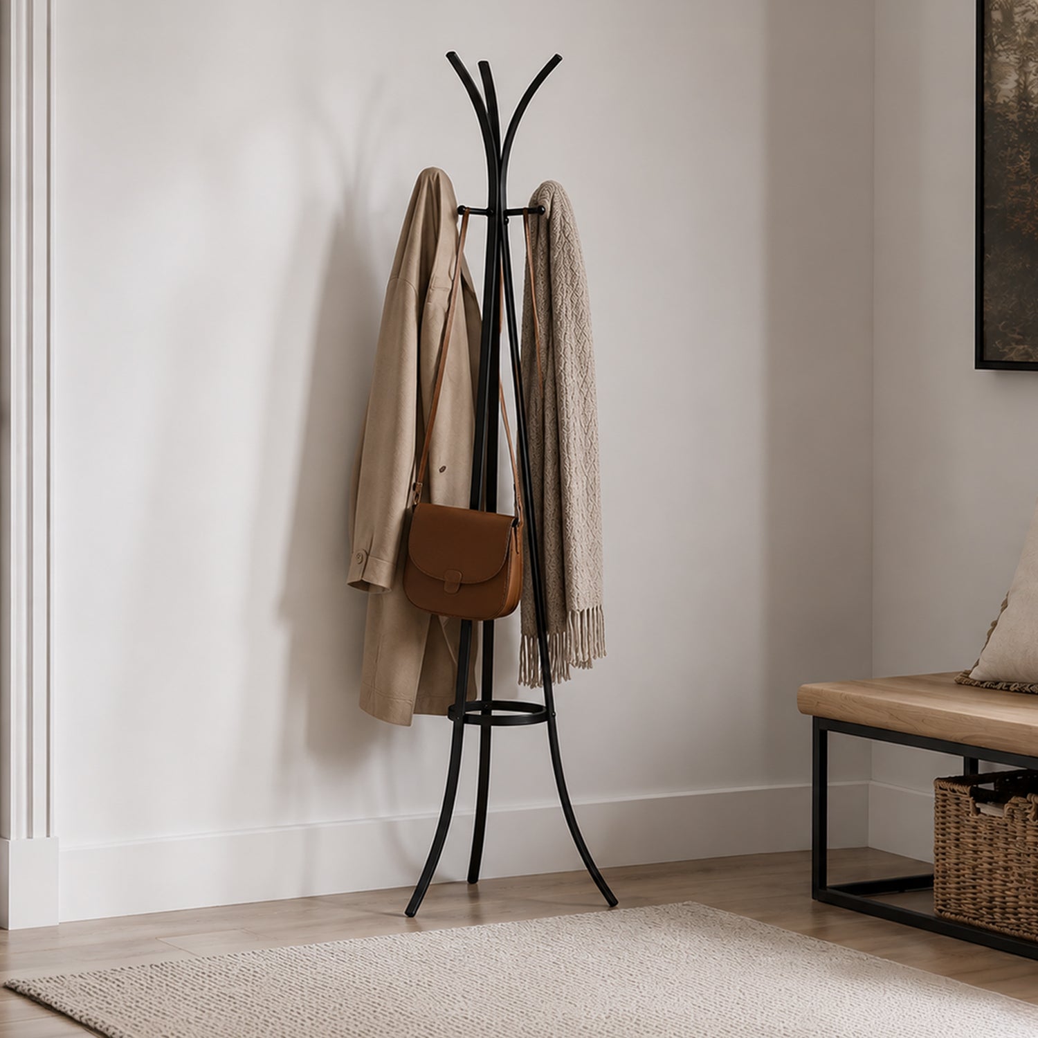 Design Plus Gatsby Metal Coat Stand in black styled in an entryway with a coat, shoulder bag and throw hanging from the hooks.