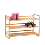 Home Co. Piper Bamboo 3 Tier Shoe Rack in natural displayed with pink gumboots and black sandals across the upper shelves.