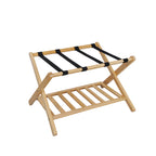 Angled product view of the Home Co. Piper Bamboo Luggage Rack in natural, featuring a folding bamboo frame, black luggage straps and a lower slatted storage shelf.