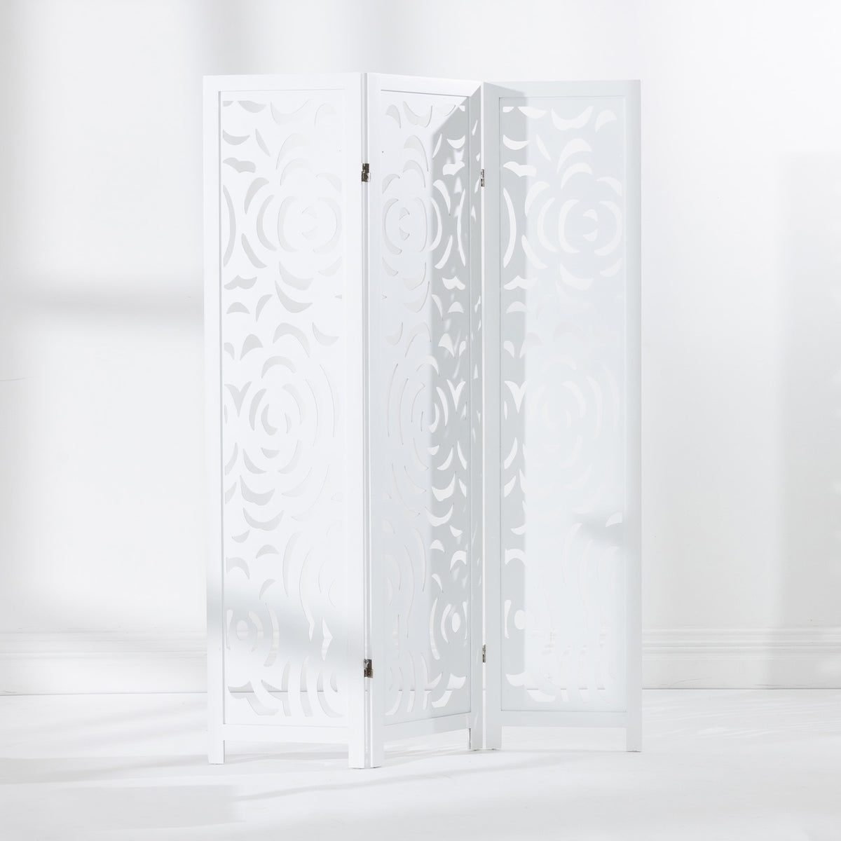 White three-panel folding screen displayed partially open, showing the floral cut-out design and hinged panels.