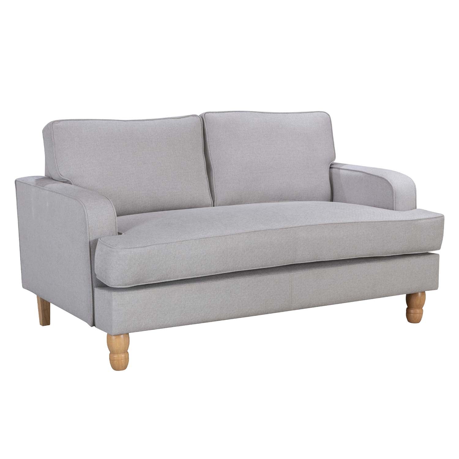 A contemporary natural two-seater sofa with clean lines, plush cushions and natural timber legs is shown against a white background, highlighting its timeless, versatile design.