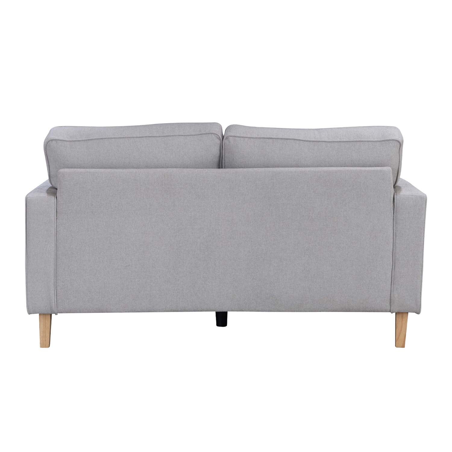 A contemporary natural two-seater sofa with clean lines, plush cushions and natural timber legs is shown against a white background, highlighting its timeless, versatile design.