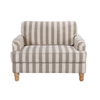 A generously sized striped armchair in soft neutral tones combines timeless style, plush comfort and natural wood legs to suit a range of classic and contemporary interiors.
