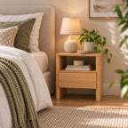 Home Co. Element Bedside Table in Natural styled beside a bed, featuring an open shelf, single drawer and warm wood-look finish.