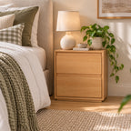 Home Co. Olsen Bedside Table in Natural styled beside a bed, featuring two spacious drawers and a warm wood-look finish.