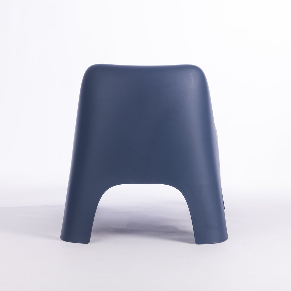 A modern moulded plastic chair in a navy blue colour.
