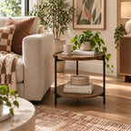 Design Plus Rio Side Table styled beside a cream sofa in a warm living room with books, decorative accessories and indoor plants.