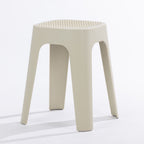 A cream stool on a clean white studio background.