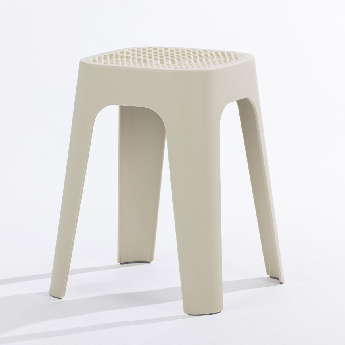 A cream stool on a clean white studio background.