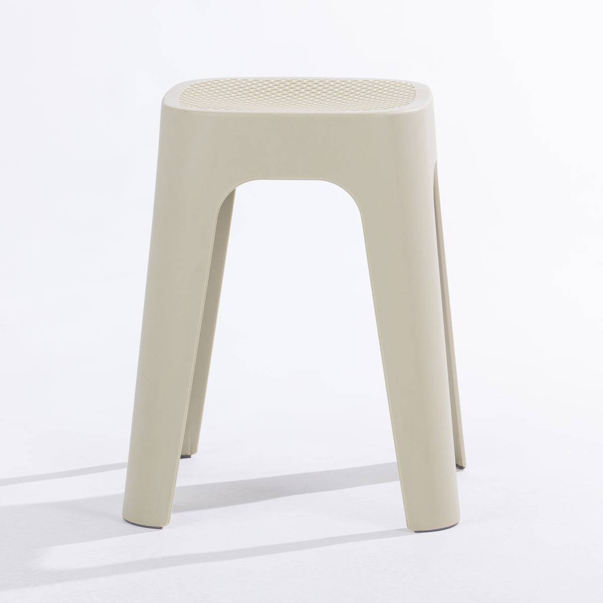 A cream stool on a clean white studio background.