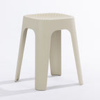 A cream stool on a clean white studio background.