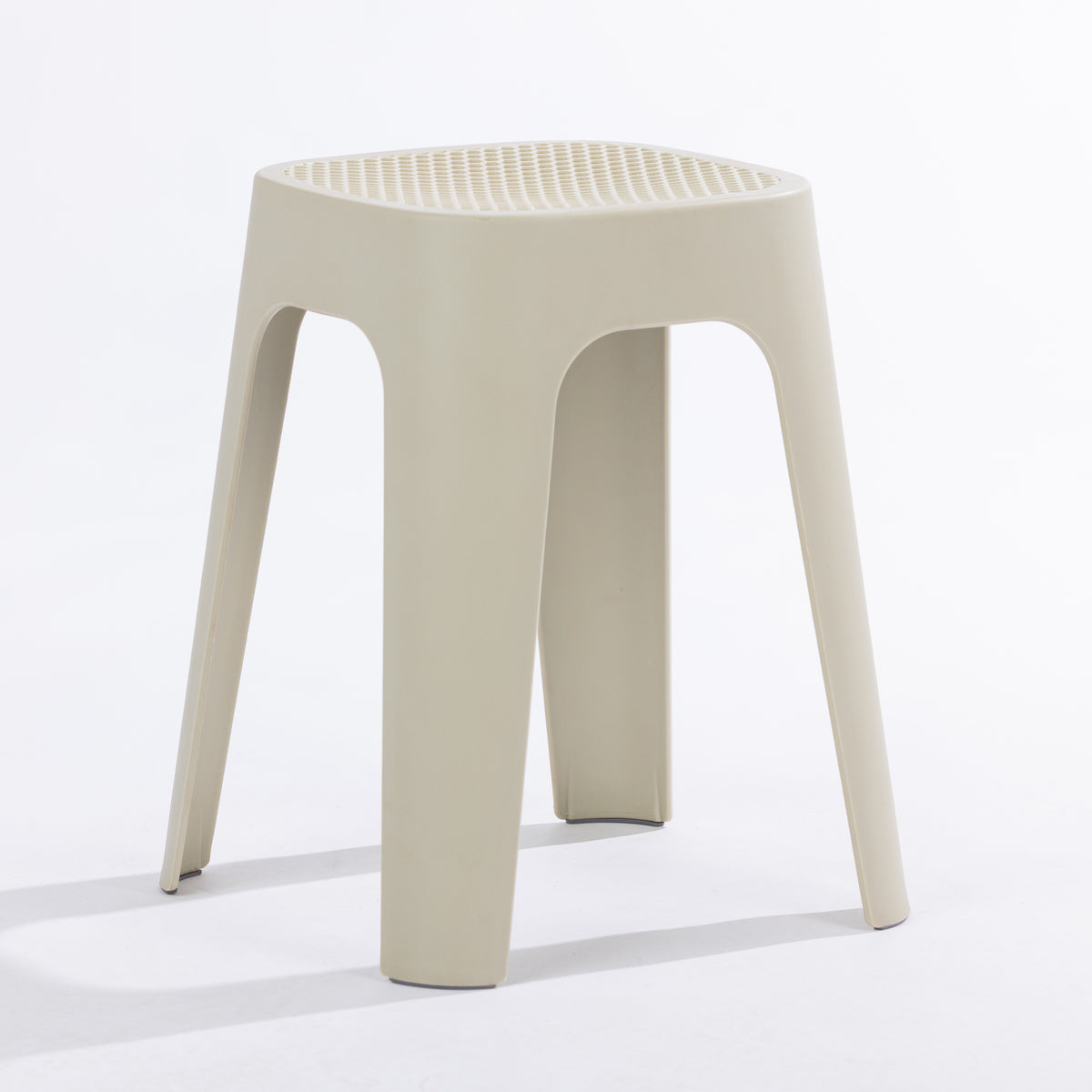 A cream stool on a clean white studio background.
