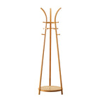 A light natural wood coat rack with a curved top, multiple horizontal pegs, and a round base, shown on a plain white background.