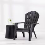 Black Cape Cod chair styled beside a Black side table with a glass jug and drinking glass against a bright white studio background.