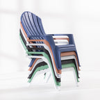 Stack of Cape Cod chairs in Navy, Tan, White, Black and Green against a white studio background.