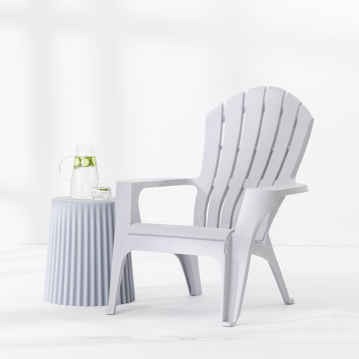 Silver Cape Cod chair styled beside a Silver side table with a glass jug and drinking glass against a bright white studio background.