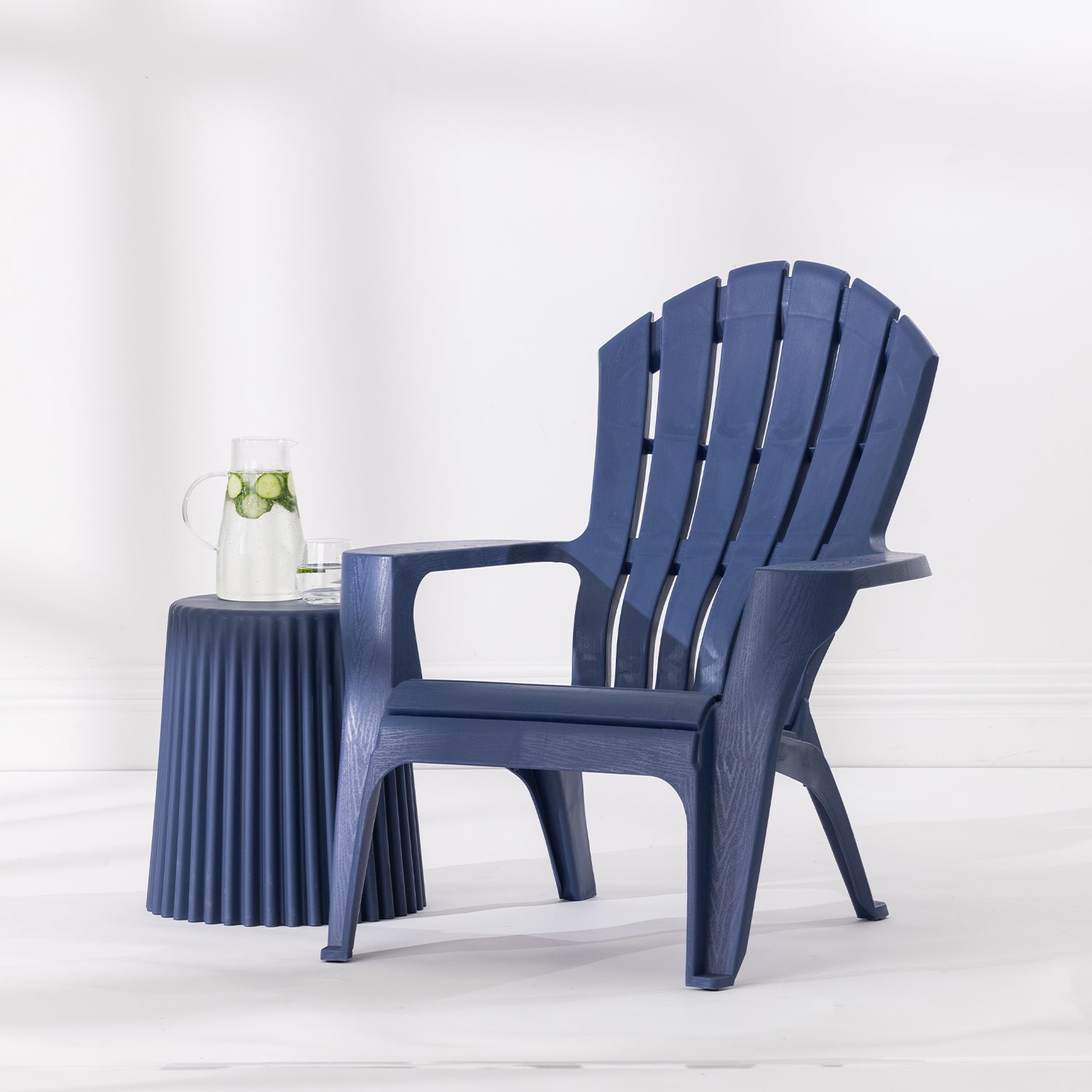Navy Cape Cod chair styled beside a Navy side table with a glass jug and drinking glass against a bright white studio background.
