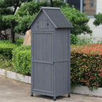 A gray outdoor storage shed with a gabled roof and door.