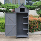 An open gray outdoor storage shed with a gabled roof and door.