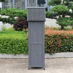 A side view of a gray outdoor storage shed.