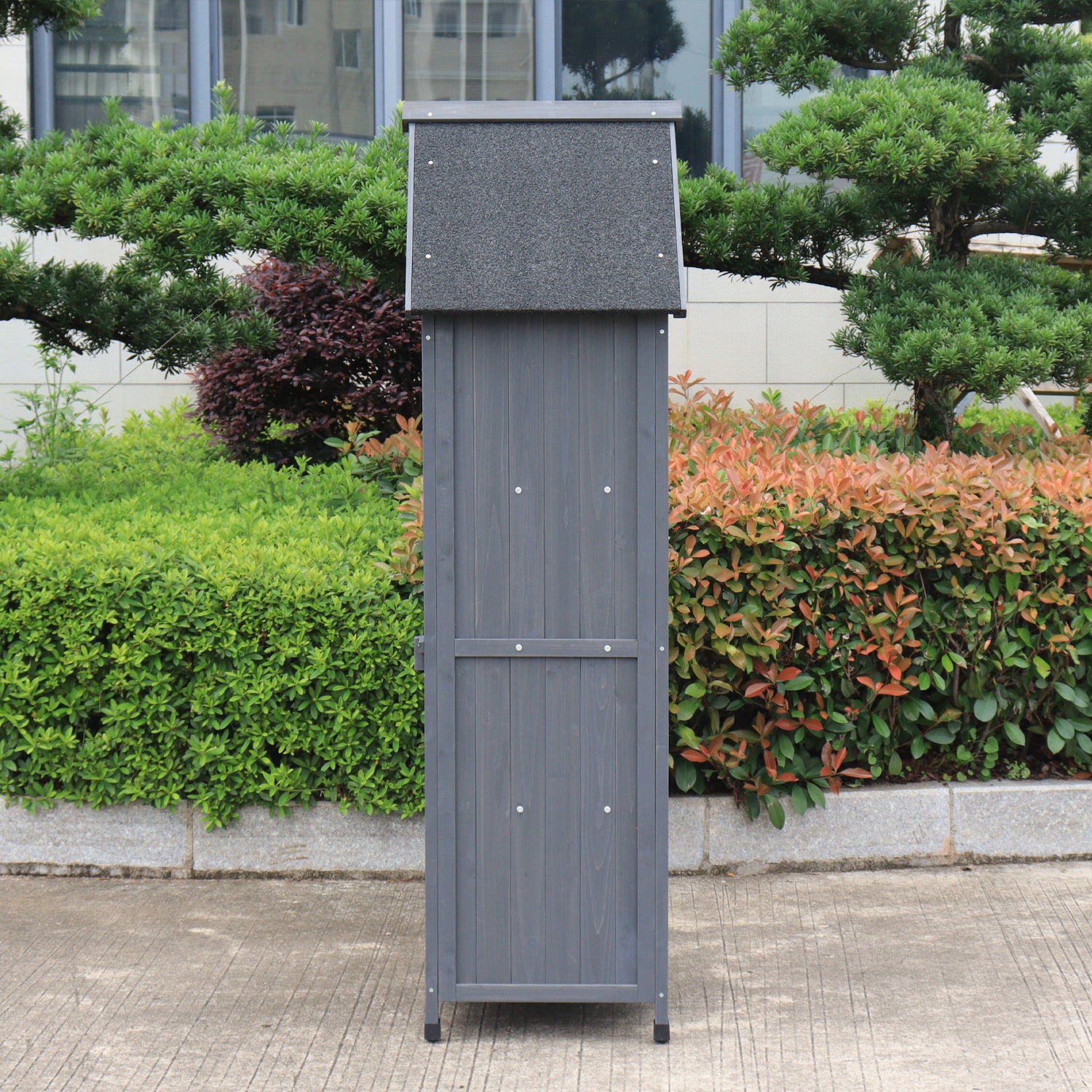 A side view of a gray outdoor storage shed.