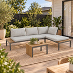 Outsidings Modular Sofa & Table Set of 3 styled in a sunny outdoor patio setting with neutral cushions, wood-look detailing and a coordinating coffee table.