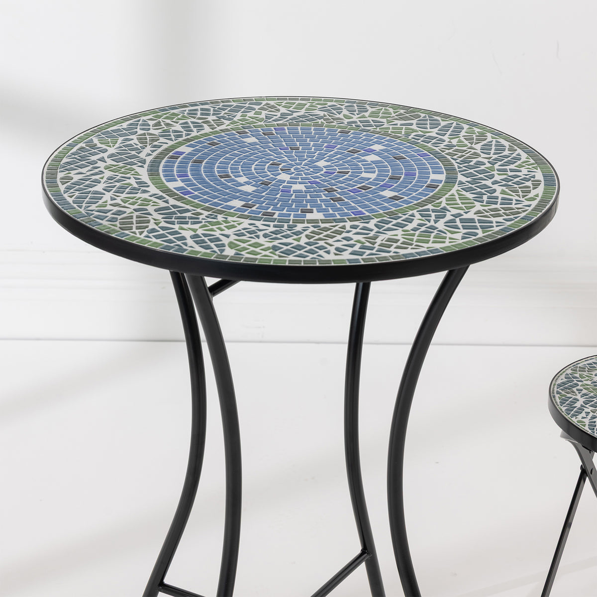Close-up of the Outsidings Blue Tile Mosaic Table showing the detailed blue, green and white circular mosaic tile pattern.
