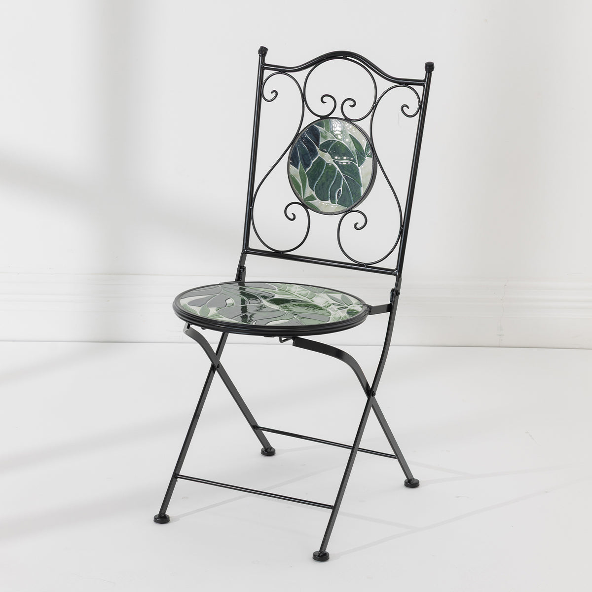 Outsidings Green Leaves Mosaic Chair with black metal frame, decorative scrollwork and green leaf mosaic seat and backrest.