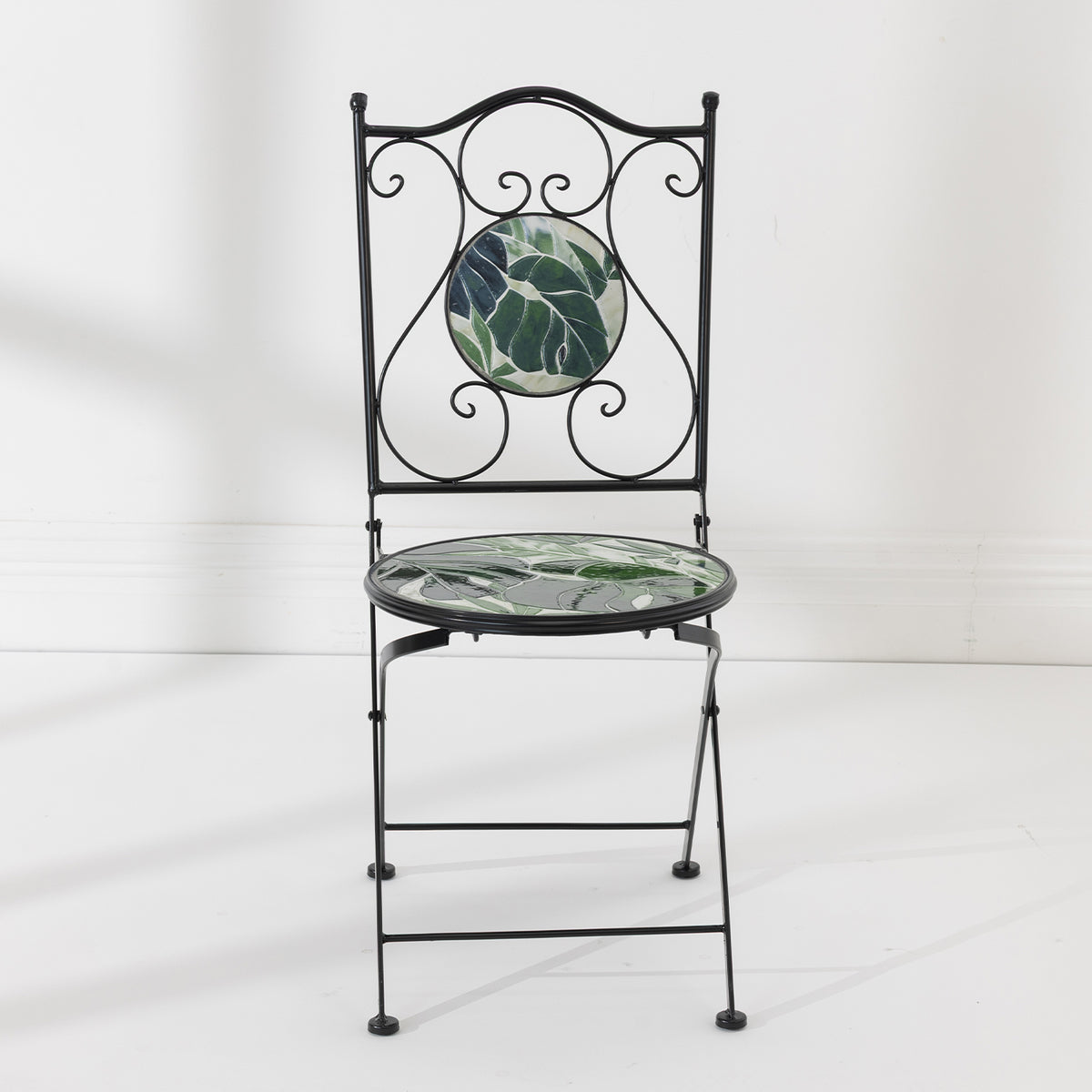 Front view of the Outsidings Green Leaves Mosaic Chair with green leaf mosaic detailing and decorative black metal frame.