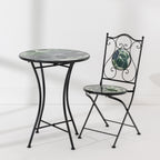 Outsidings Green Leaves Mosaic Chair and matching round table featuring green leaf mosaic designs and black metal frames.