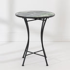 Outsidings Green Leaves Mosaic Table with round green leaf mosaic top and curved black metal frame.
