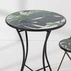 Close-up of the Outsidings Green Leaves Mosaic Table showing the detailed green leaf mosaic tabletop and black metal frame.
