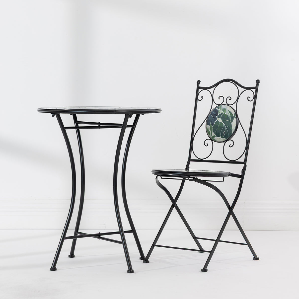 Outsidings Green Leaves Mosaic Table displayed beside the matching mosaic chair.