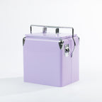 Lilac cooler box displayed from an angled view, highlighting its sturdy metal carry handle, silver corner accents, removable lid and convenient built-in bottle opener on the side.