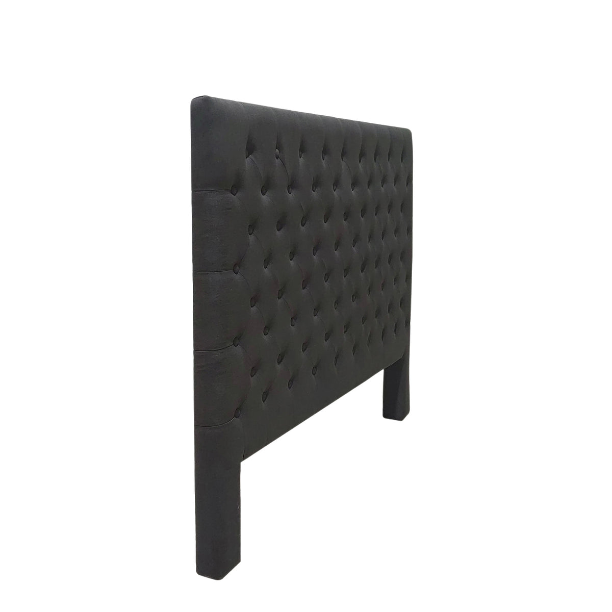 Side angle view of the Dark Grey Jade Linen Look Headboard highlighting its padded construction, diamond tufting and upholstered legs.