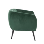 Design Republique Olivia Green Velvet Chair with a curved wraparound profile, green velvet upholstery and slim black metal legs, shown against a white background.