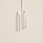 Close-up of the white sideboard's internal door frame, showing the magnetic door catch and fastening details.