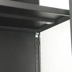 Close-up of the black TV cabinet's internal shelving, highlighting the shelf support rail and integrated lighting with touch control.