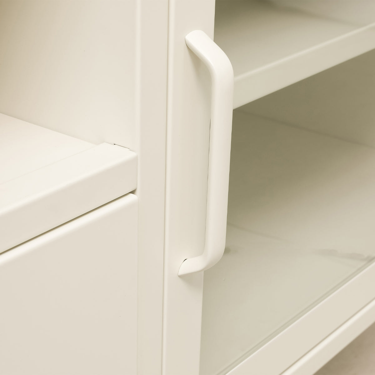 Close-up of the white TV cabinet's open drawer, showing its spacious interior and metal sliding runners.