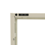 Close-up of the white TV cabinet's glass-panelled door, highlighting the curved white vertical handle and internal shelving.