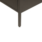Close-up of the corner of a black cabinet , showing the leg and edge against a plain white background.