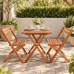 Natural Santos bistro set styled on a sunny garden patio with tableware, flowers and greenery, creating a relaxed outdoor dining setting.