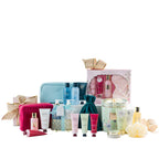 Grace & Gild Royal Lily & Vanilla body care gift set containing body wash, body scrub and body lotion in pale green and gold floral packaging.