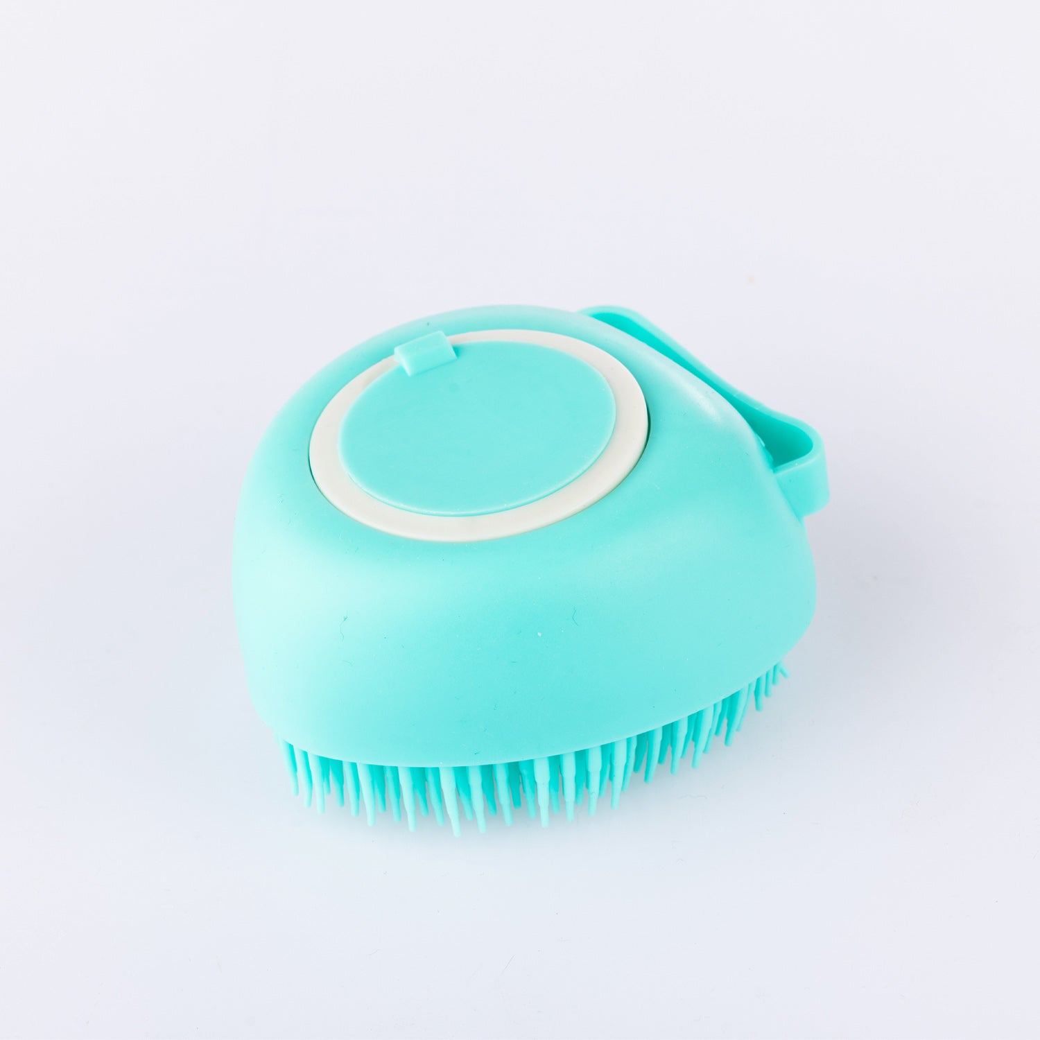 Grace & Gild Mae Silicone Shampoo Brush in sea green, showing the soft silicone bristles and easy-grip handle on a white background.