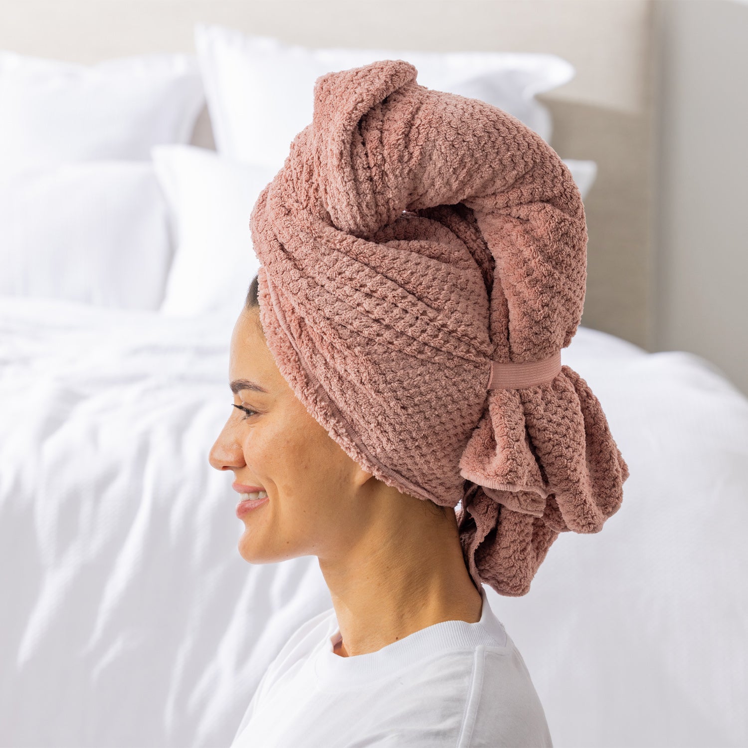 Grace & Gild Clementine Textured Hair Wrap in Light Pink, shown from the side with the wrap secured at the back.