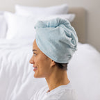 Grace & Gild Freya Pamper Set in Blue, showing a side view of the blue hair wrap on a model.