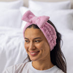 Grace & Gild Freya Pamper Set in rosewater, showing a model wearing the soft blue headband.