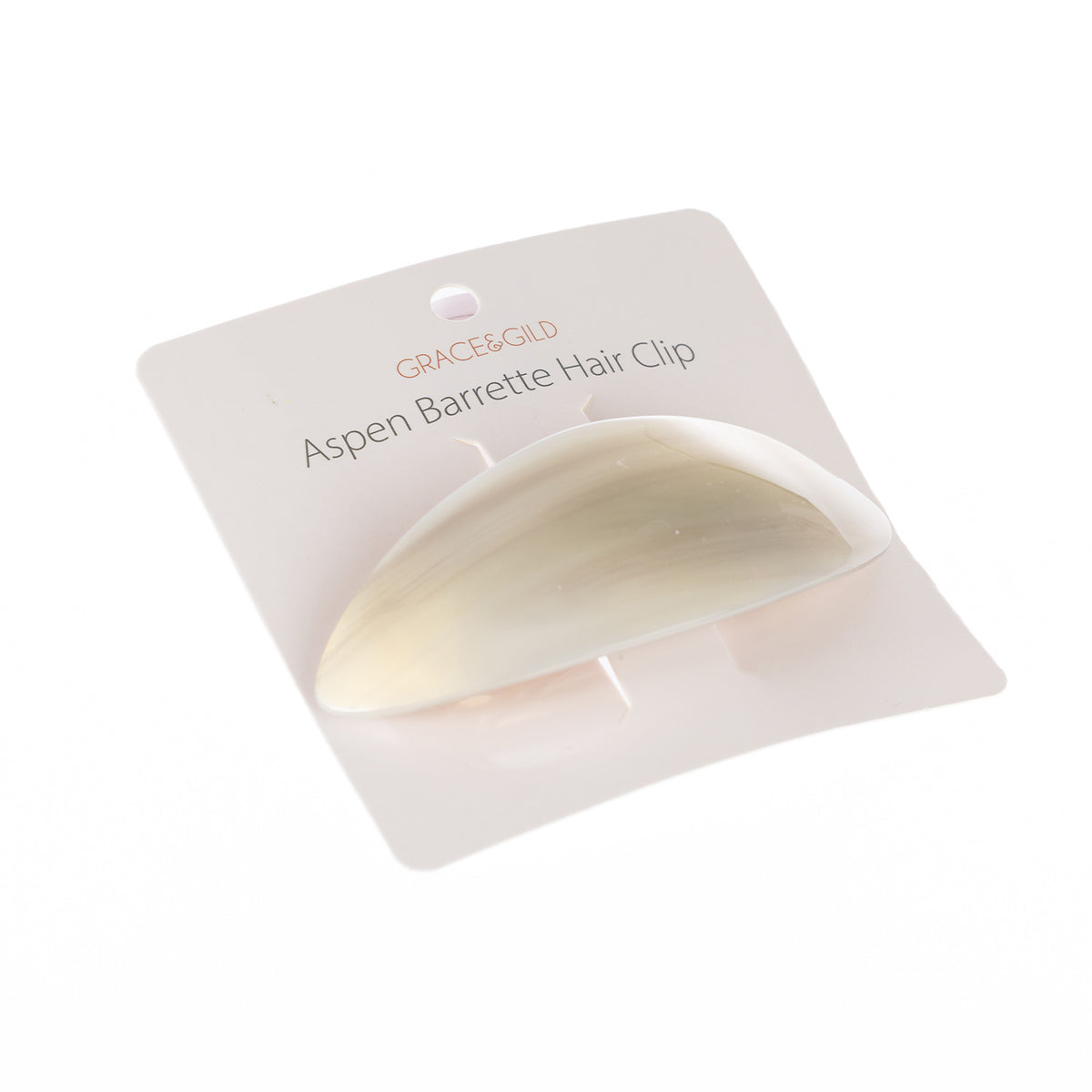 Grace & Gild Aspen Barrette Hair Clip in an ivory beige marbled finish displayed on retail packaging.