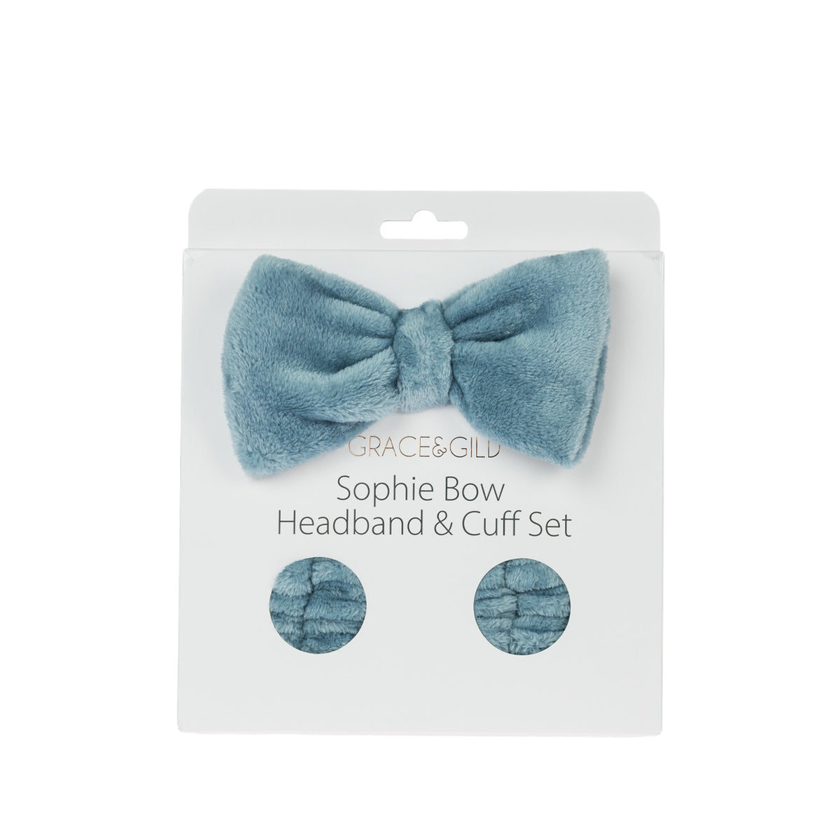 Grace & Gild Sophie Bow Headband & Cuff Set in blue, displayed in retail packaging with a plush bow headband and matching wrist cuffs.